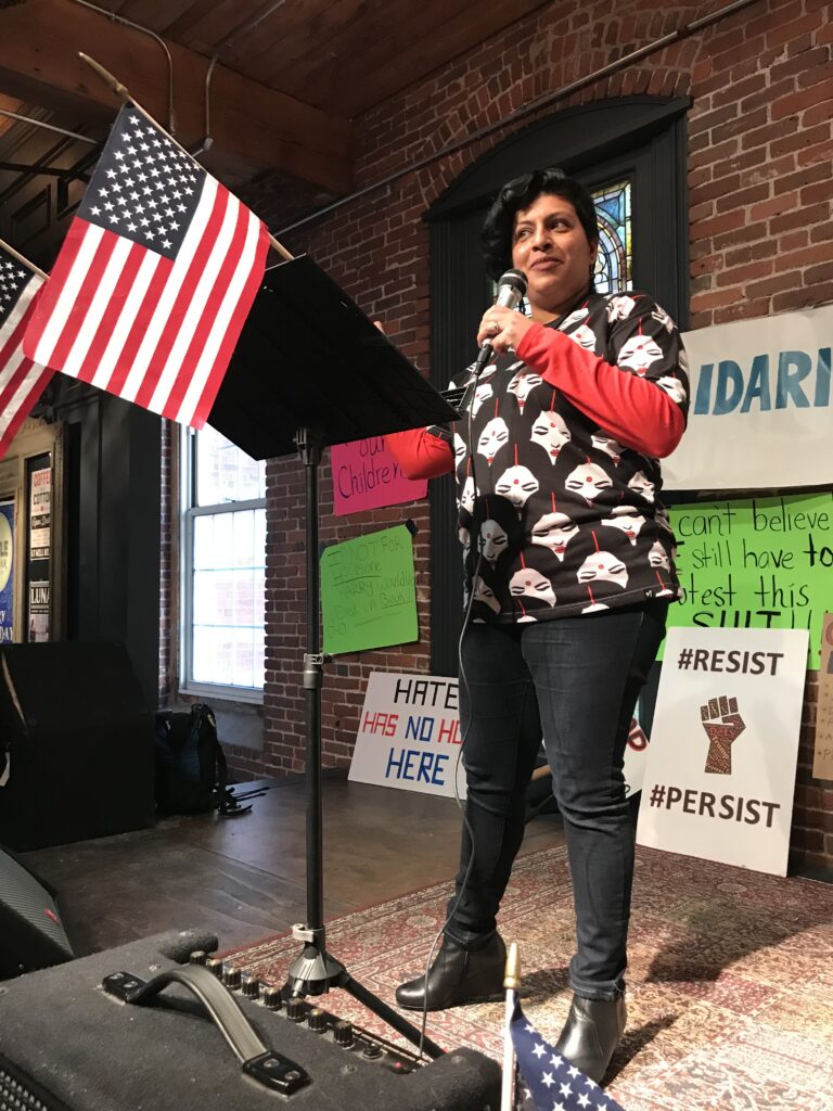 Manisha Bewtra speaking at the Solidarity Lowell Women's March in 2018.