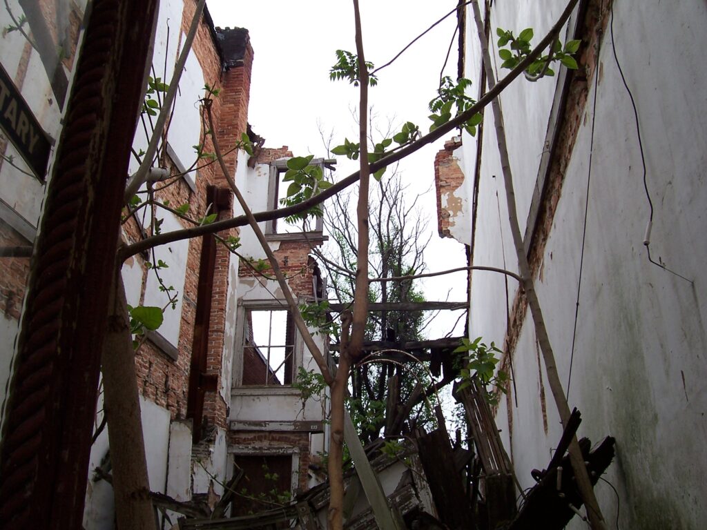 Inside a unit that had only a façade intact. Manisha was responsible for much of the pre-construction due diligence, as well as taking official minutes at construction progress meetings.