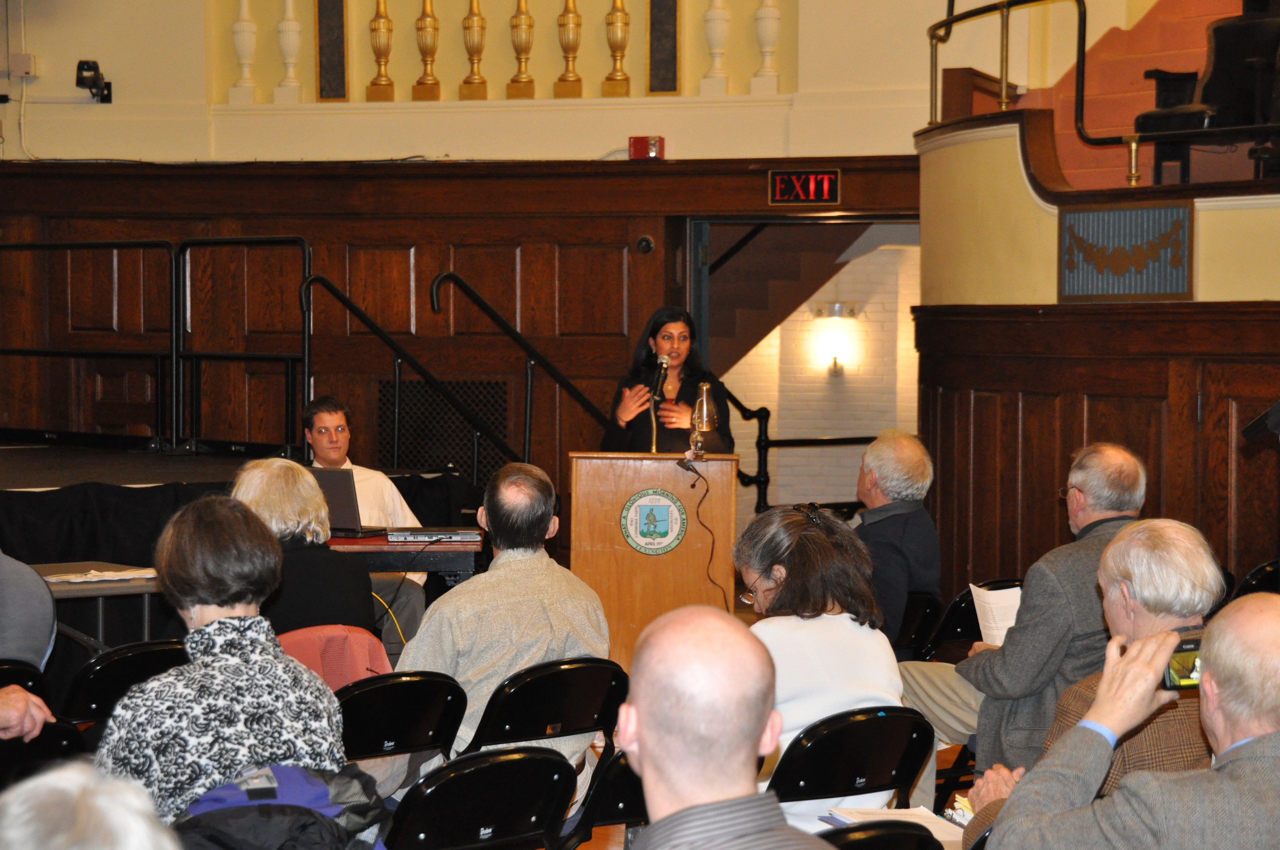 Manisha presenting at Cary Memorial Hall in Lexington in 2010.