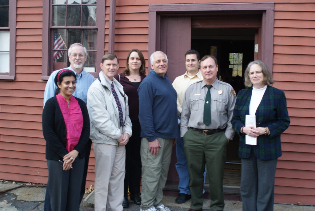 Manisha is pictured here with Battle Road Scenic Byway Working Group members in 2009 at the Old Schwamb Mill in Arlington.