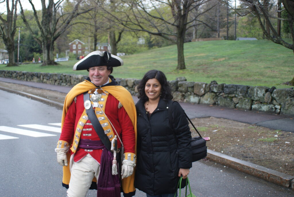Manisha had so much fun with this project! Here, she is pictured with Reenactor and Battle Road Scenic Byway Tourism Subcommittee member Paul O'Shaughnessy following a reenactment in Lexington, April 2010.